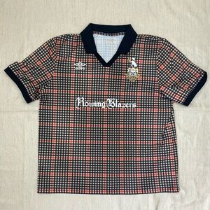 Rowing Blazers x Umbro Hunter Check Soccer Jersey - Black and Orange over tan